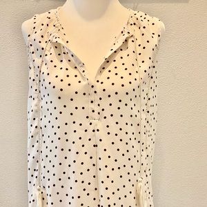 White peasant style sleeveless blouse